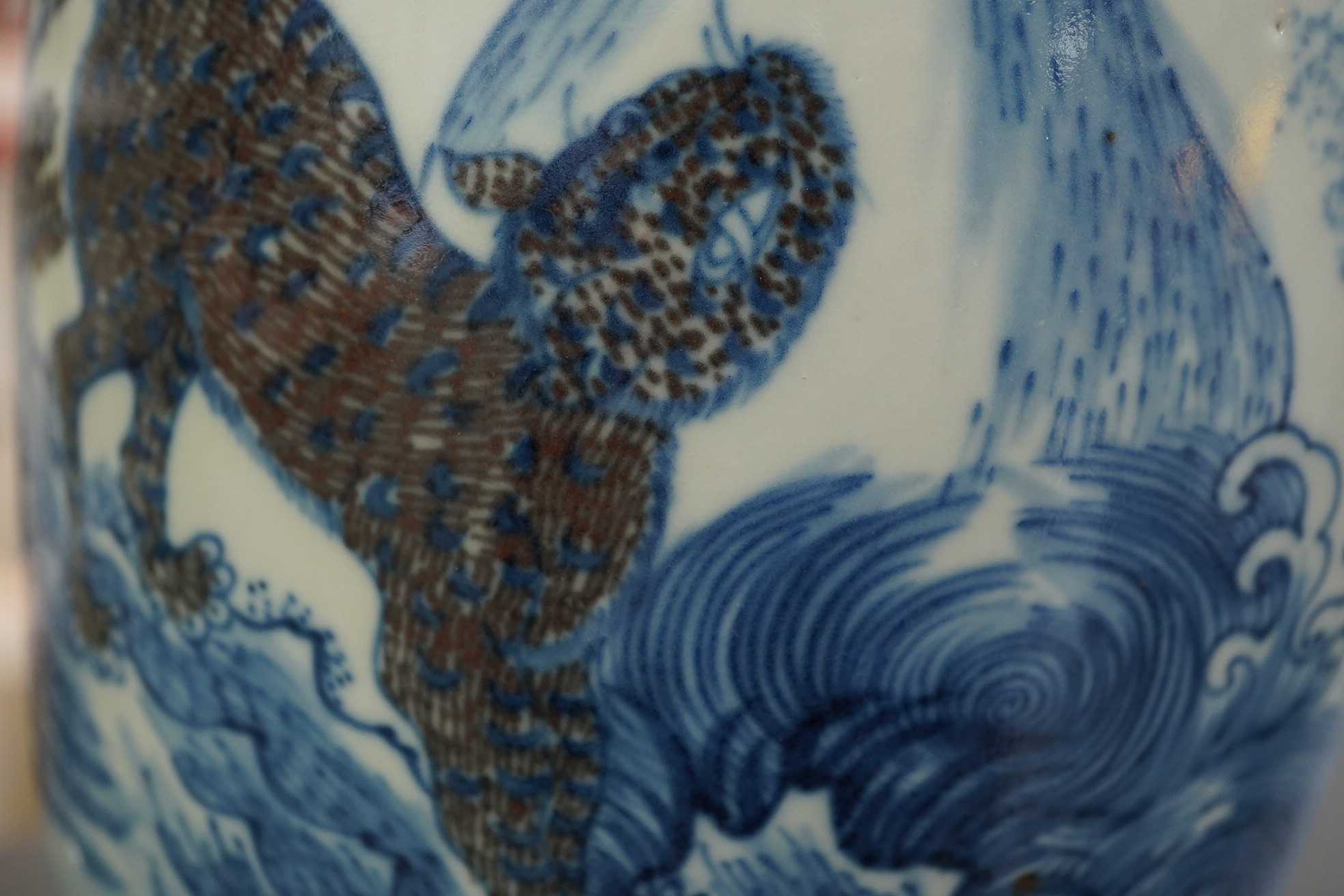 A Chinese underglaze blue and copper red ’dragon and tiger’ baluster vase, possibly 19th century